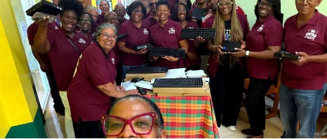 NY Chapter alumni in maroon shirts gathered together