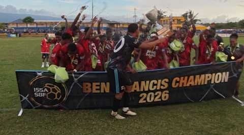 Glenmuir High footballers celebrating with the trophy behind a Ben Francis Champion 2026 banner